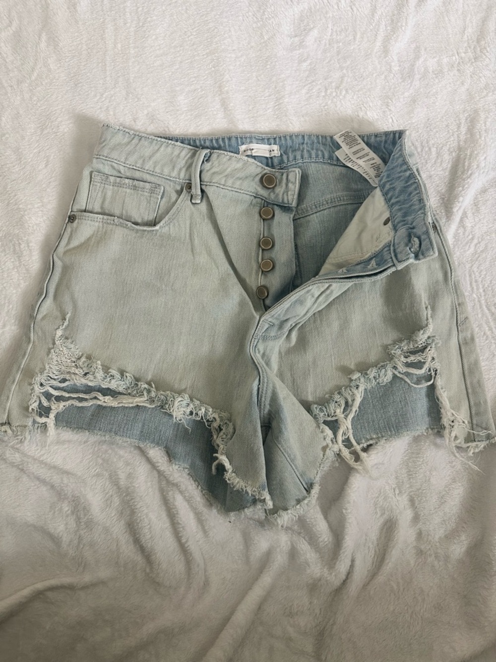 Good American Light Wash Distressed Button-Fly Denim Shorts